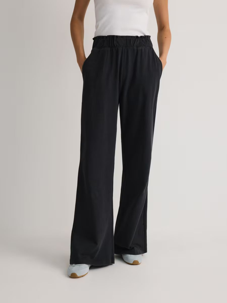 Pantaloni da jogging svasati - grigio scuro