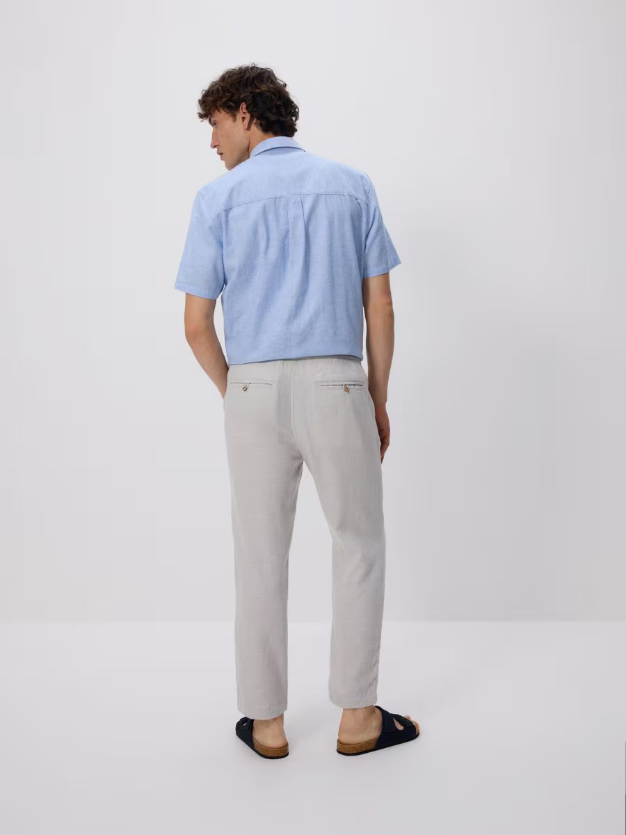 Pantaloni carrot in misto lino