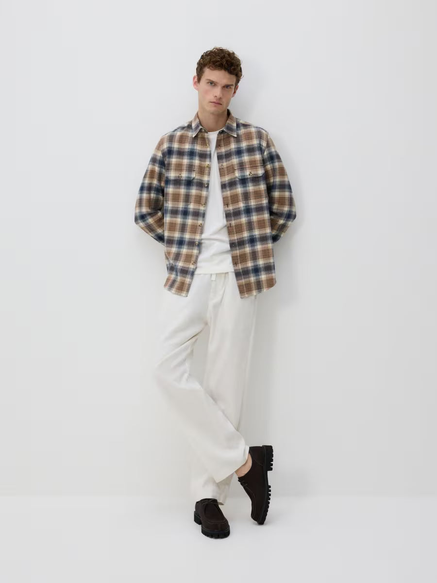 Pantaloni dritti in lino-panna