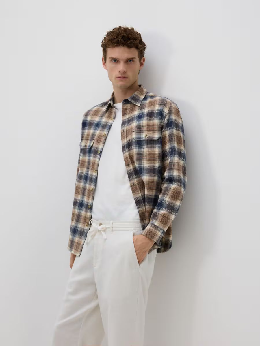 Pantaloni dritti in lino-panna
