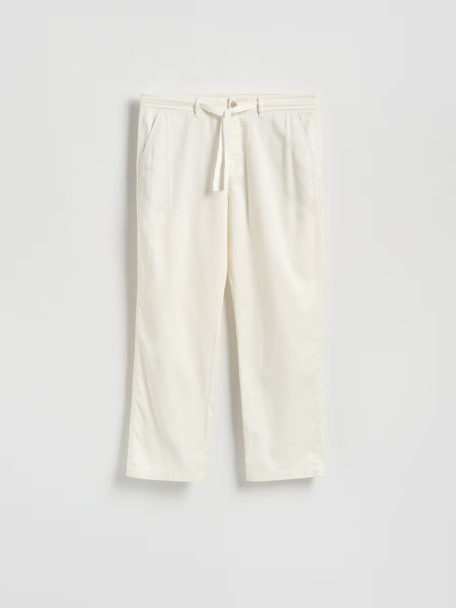 Pantaloni dritti in lino-panna